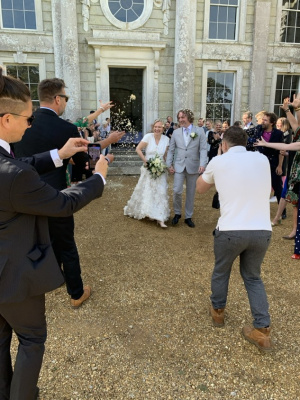 Confetti shot after ceremony at front of the house