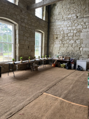 Same wedding using Dirtroom ( Dining Parlour ) as DIY Kitchen note wooden platters set out ready to fill and then fit in table centers .